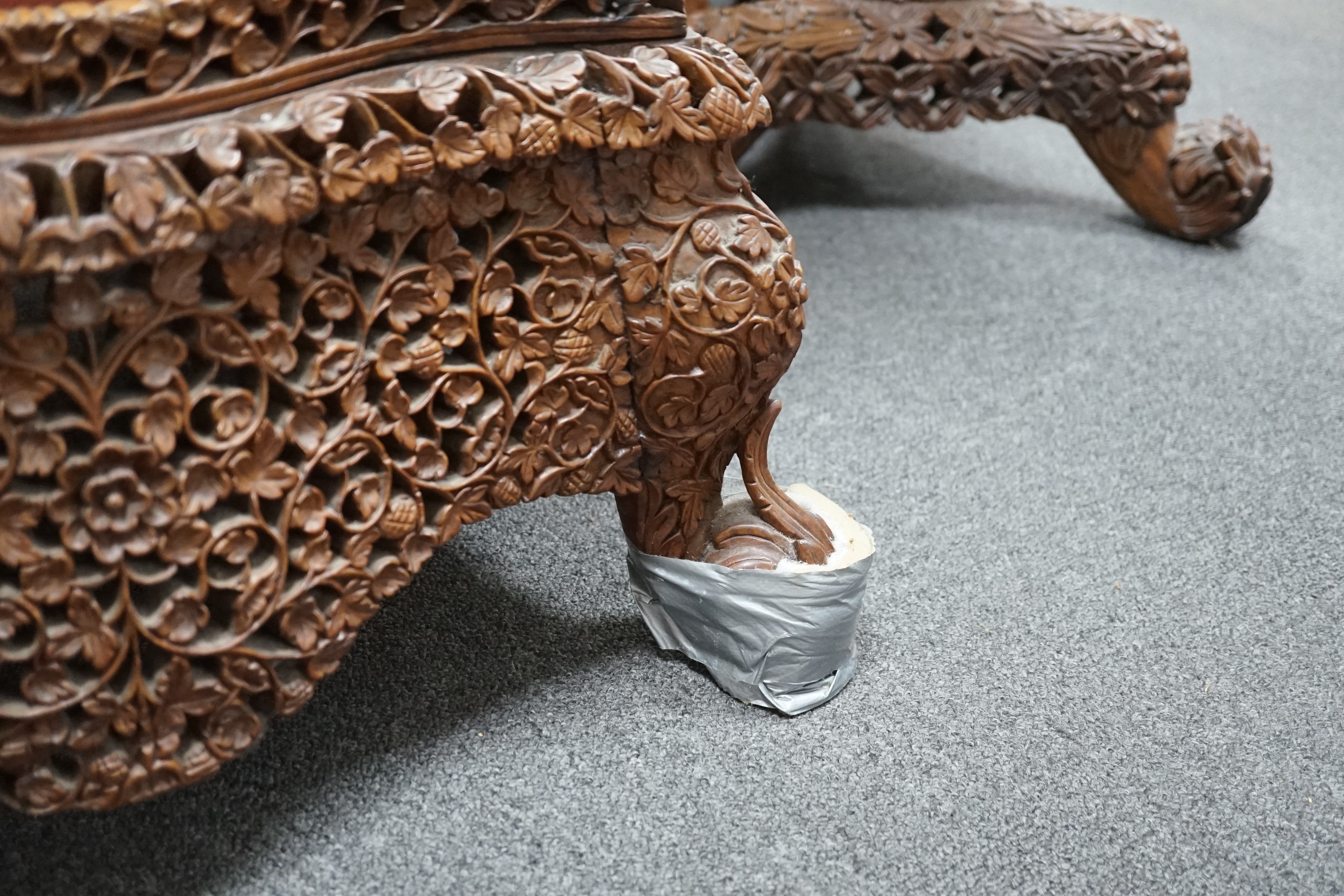 A Burmese carved hardwood circular occasional or centre table, diameter 57cm height 74cm, together with a similar side chair and foot stool